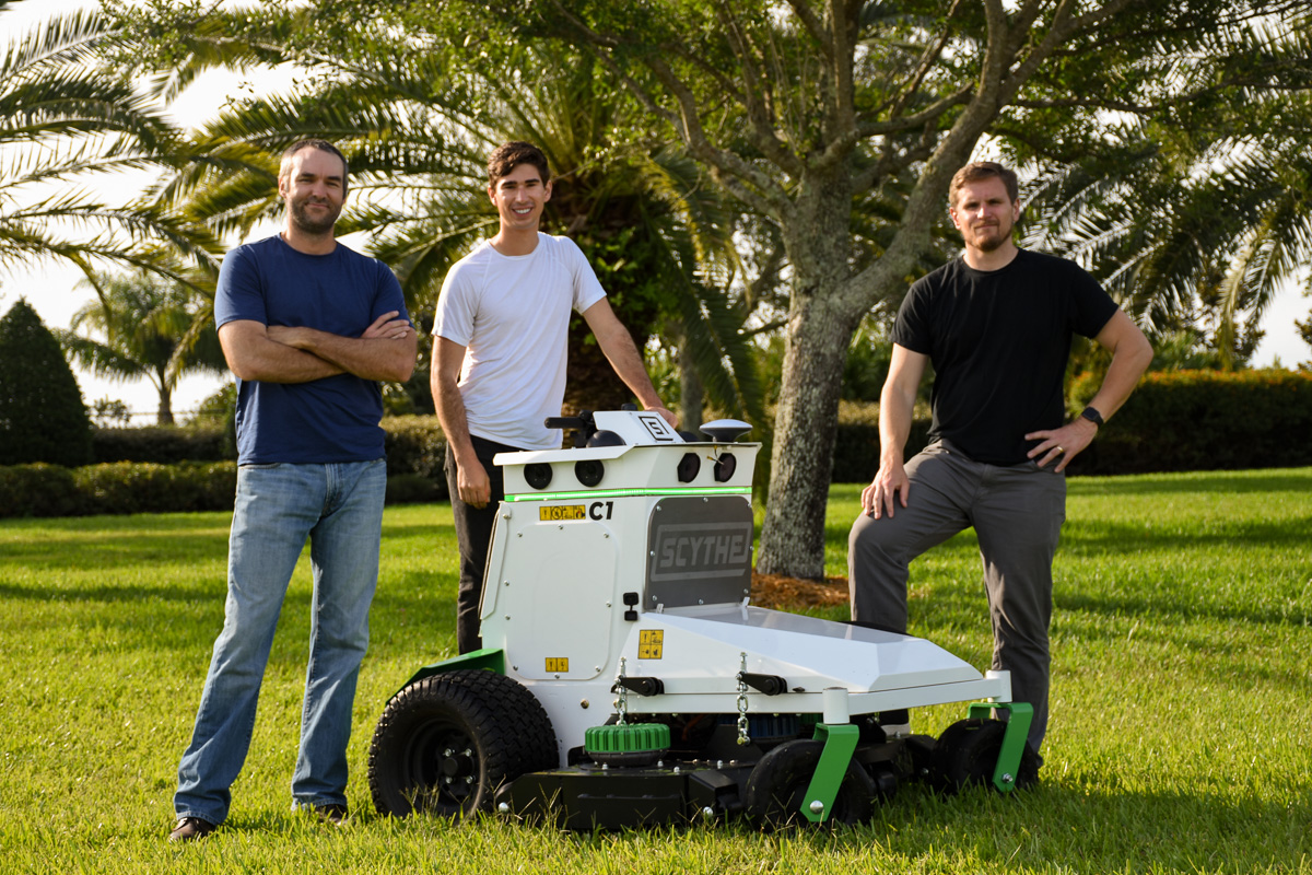 Three Scythe co-founders, and their robot.